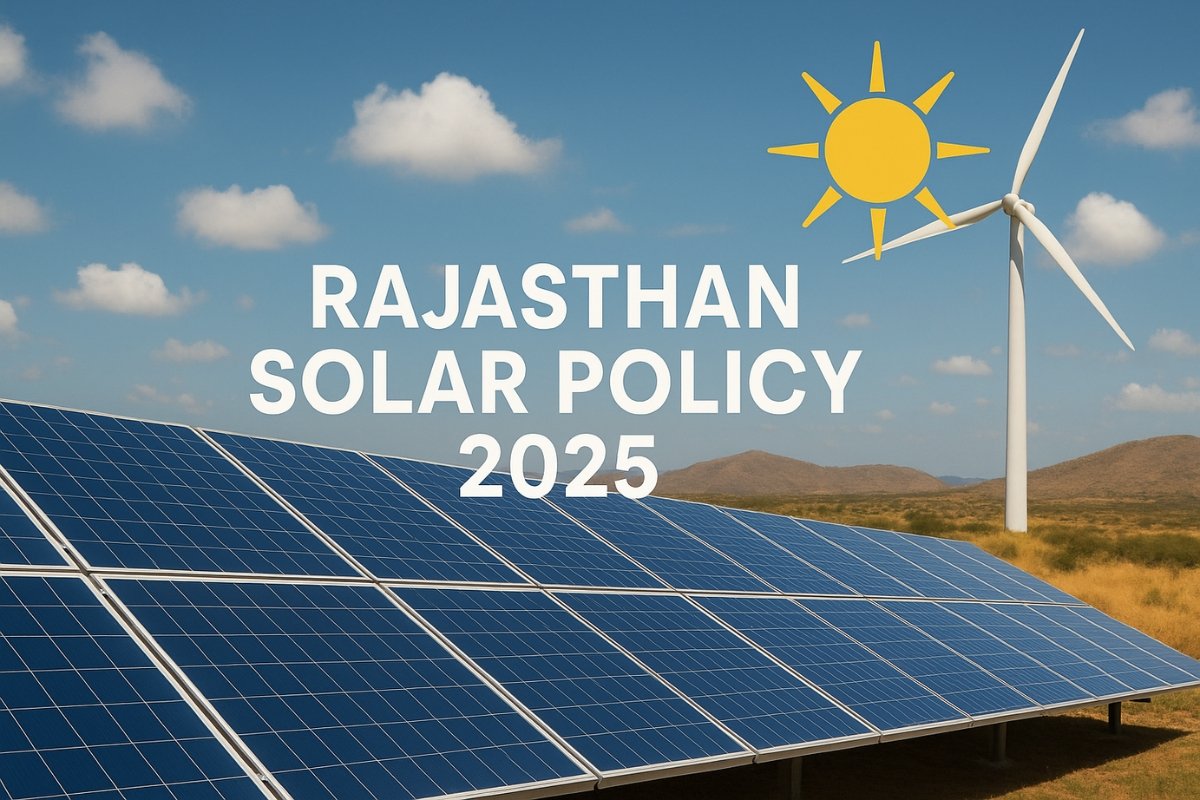 Solar panels installed in a desert region with a wind turbine in the background under a clear sky, representing Rajasthan Solar Policy 2025
